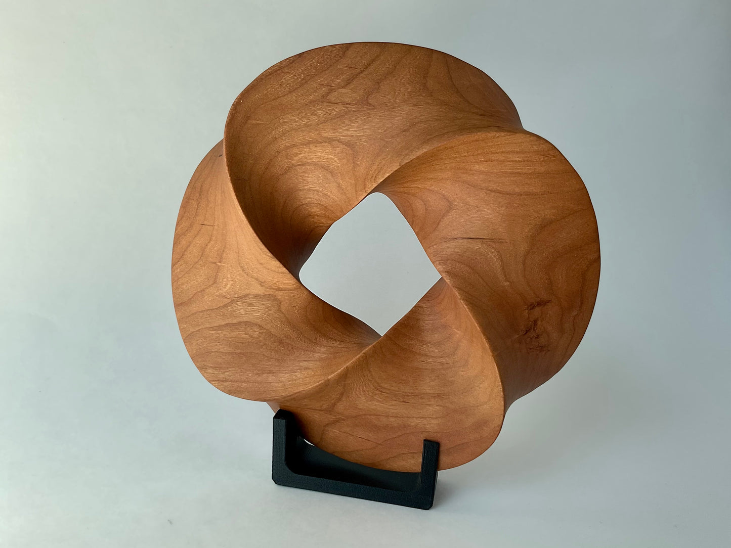 Quadruple-folded Möbius Strip-like Cherry Wood Carving, 7" diameter