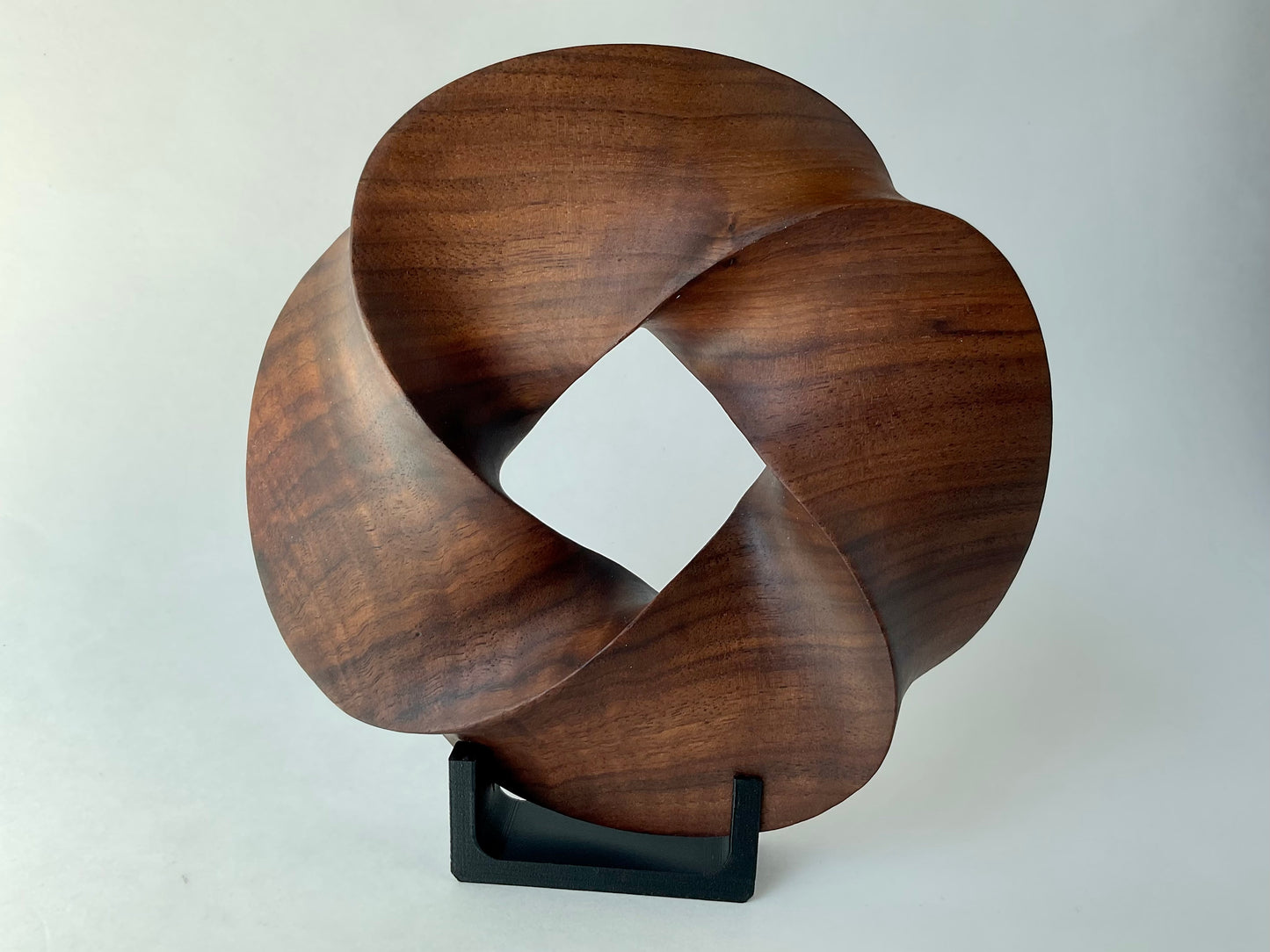 Quadruple-folded Möbius Strip-like Walnut Wood Carving, 7" diameter