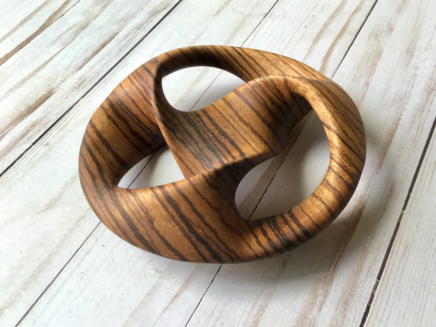 Triquetra Mobius Strip-like Wooden Sculpture, ZebraWood, 5"