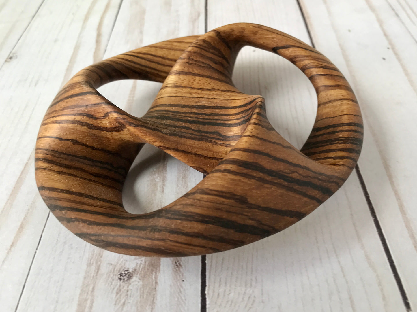 Triquetra Mobius Strip-like Wooden Sculpture, ZebraWood, 5"