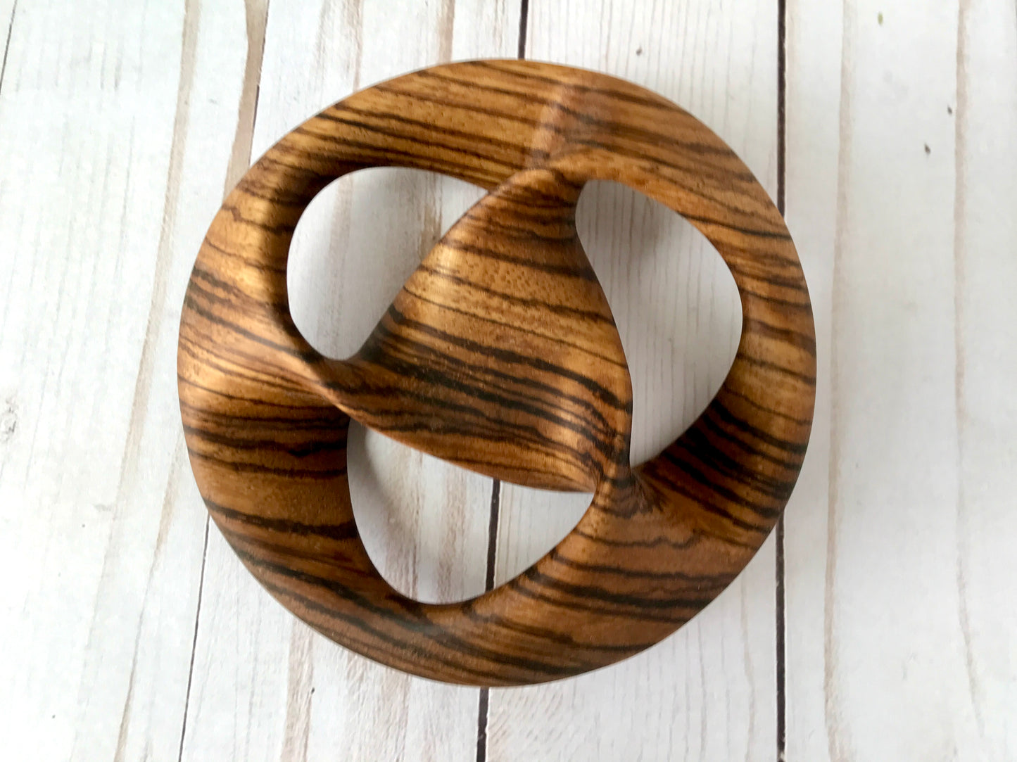 Triquetra Mobius Strip-like Wooden Sculpture, ZebraWood, 5"